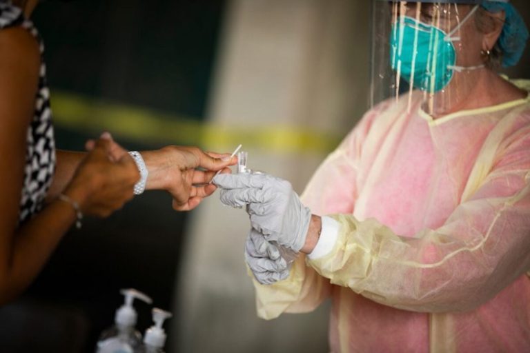 Vaccines may arrive in record time, but the virus has been faster